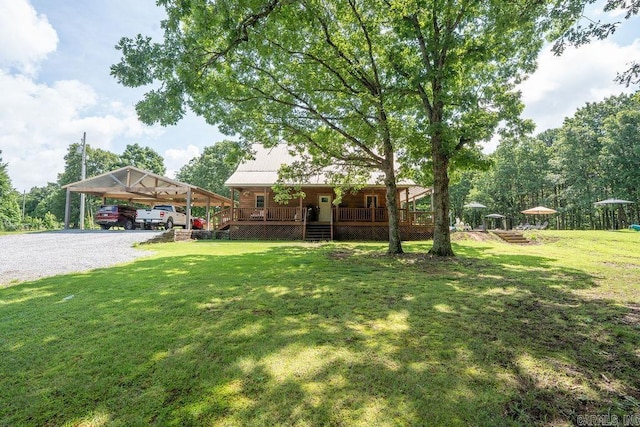 2838 Mountain View Rd, Drasco, AR 72530 - view of green lawn featuring a carport, gravel driveway, and a porch