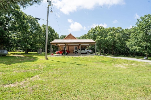 2838 Mountain View Rd, Drasco, AR 72530 - view of green lawn featuring a carport and driveway