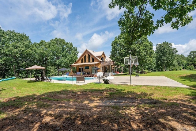 2838 Mountain View Rd, Drasco, AR 72530 - rear view of house featuring a lawn, an outdoor pool, and a patio