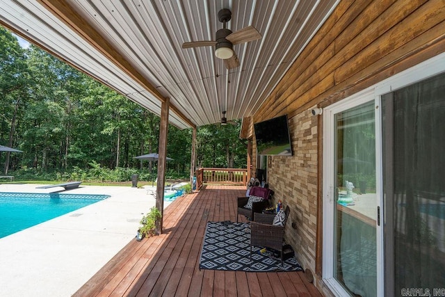 2838 Mountain View Rd, Drasco, AR 72530 - wooden deck featuring ceiling fan and an outdoor pool
