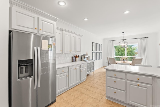 7 Chalamont Way, Little Rock, AR 72223 - kitchen featuring stainless steel refrigerator with ice dispenser, tasteful backsplash, light tile patterned floors, light countertops, and white cabinets