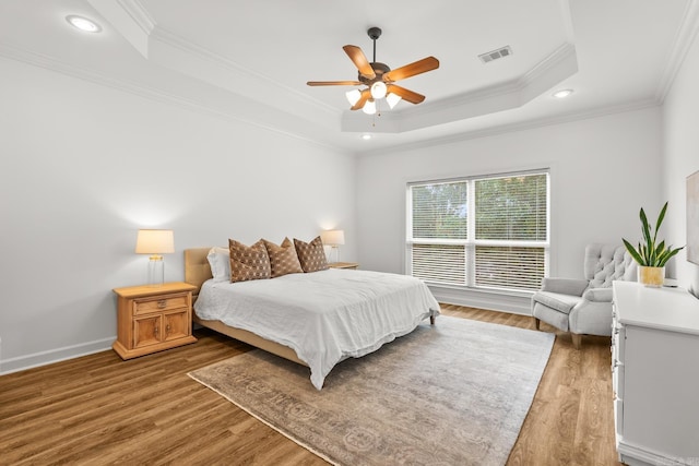 7 Chalamont Way, Little Rock, AR 72223 - bedroom with a tray ceiling, ornamental molding, wood finished floors, a ceiling fan, and recessed lighting