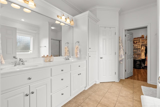7 Chalamont Way, Little Rock, AR 72223 - bathroom featuring a shower stall, tile patterned floors, double vanity, ornamental molding, and a walk in closet