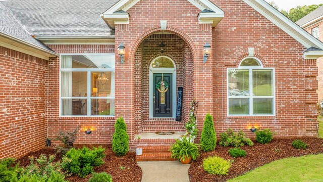 7 Chalamont Way, Little Rock, AR 72223 - view of exterior entry featuring brick siding and a shingled roof