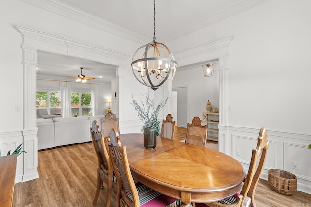 7 Chalamont Way, Little Rock, AR 72223 - dining space featuring a decorative wall, light wood-style flooring, a chandelier, ornamental molding, and ceiling fan