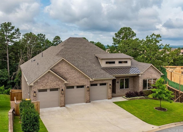 41 Haywood Ct, Little Rock, AR 72223 - view of front of house featuring brick siding, an attached garage, roof with shingles, driveway, and a standing seam roof