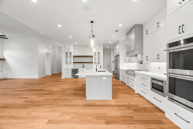 41 Haywood Ct, Little Rock, AR 72223 - kitchen featuring wine cooler, appliances with stainless steel finishes, open shelves, recessed lighting, and light countertops