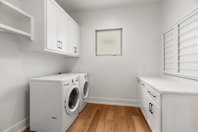 41 Haywood Ct, Little Rock, AR 72223 - laundry area with cabinet space, separate washer and dryer, and light wood finished floors
