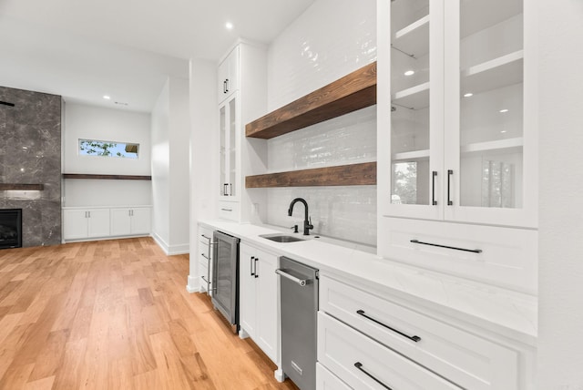 41 Haywood Ct, Little Rock, AR 72223 - kitchen with beverage cooler, open shelves, white cabinetry, light wood-style floors, and recessed lighting