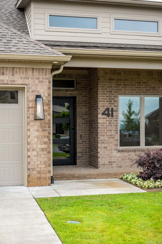 41 Haywood Ct, Little Rock, AR 72223 - property entrance featuring a shingled roof and brick siding