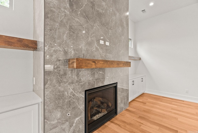 41 Haywood Ct, Little Rock, AR 72223 - detailed view of a fireplace, wood finished floors, and recessed lighting