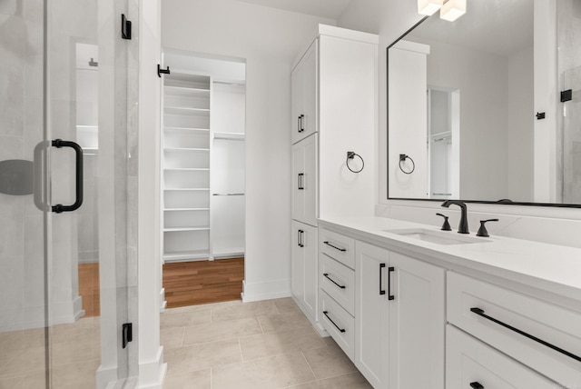 41 Haywood Ct, Little Rock, AR 72223 - full bath featuring vanity, a spacious closet, and a stall shower
