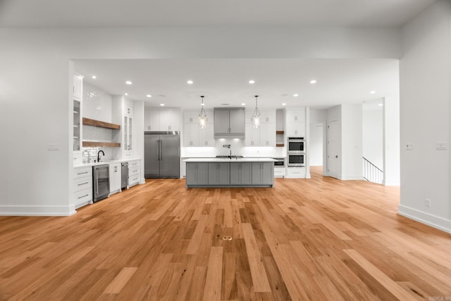 41 Haywood Ct, Little Rock, AR 72223 - kitchen with stainless steel built in fridge, beverage cooler, open shelves, white cabinets, and recessed lighting