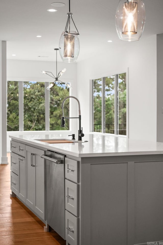 41 Haywood Ct, Little Rock, AR 72223 - kitchen featuring dishwasher, light countertops, wood finished floors, recessed lighting, and decorative light fixtures