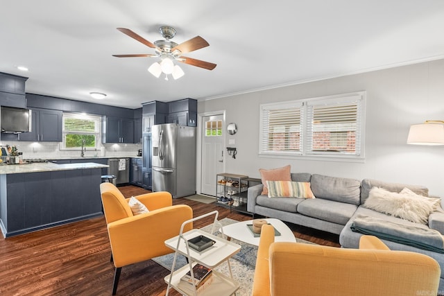 7002 Amherst Dr, Little Rock, AR 72205 - living area featuring a ceiling fan, dark wood-style flooring, and ornamental molding