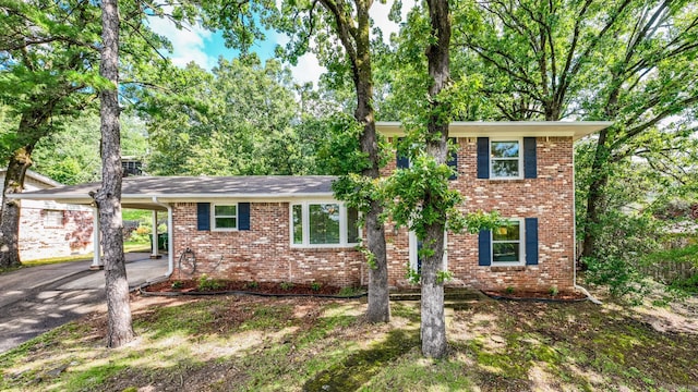7002 Amherst Dr, Little Rock, AR 72205 - view of front of home with brick siding, asphalt driveway, and an attached carport