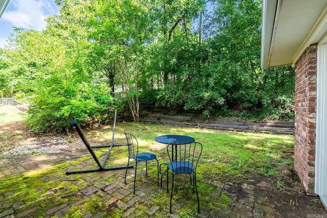 7002 Amherst Dr, Little Rock, AR 72205 - view of green lawn with a patio