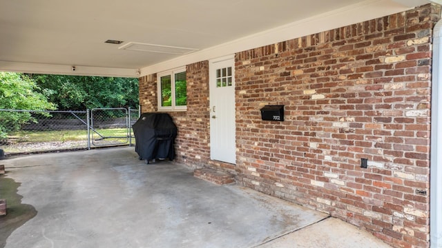 7002 Amherst Dr, Little Rock, AR 72205 - view of patio with grilling area, an attached carport, and a gate