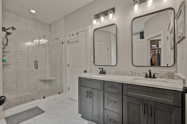 2720 Paradise Hls, Jonesboro, AR 72405 - full bathroom featuring marble finish floors, a stall shower, double vanity, and a walk in closet