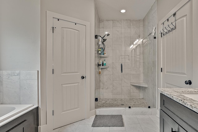 2720 Paradise Hls, Jonesboro, AR 72405 - bathroom with a shower stall, vanity, marble look tile flooring, and a tub