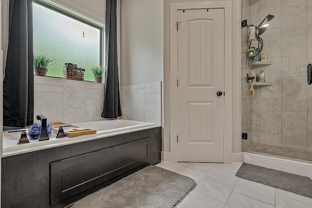 2720 Paradise Hls, Jonesboro, AR 72405 - full bathroom with marble look tiles, a stall shower, and a garden tub