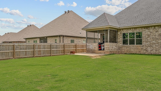 2720 Paradise Hls, Jonesboro, AR 72405 - fenced backyard with a sunroom and a patio area