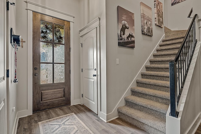 2720 Paradise Hls, Jonesboro, AR 72405 - entryway with stairway and light wood-style floors