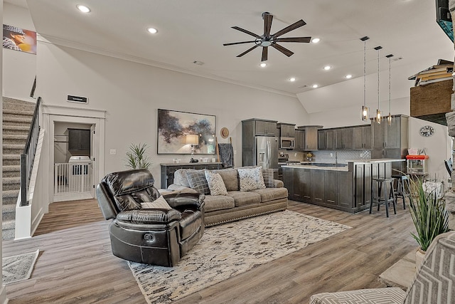 2720 Paradise Hls, Jonesboro, AR 72405 - living room with ornamental molding, ceiling fan, light wood finished floors, recessed lighting, and stairway
