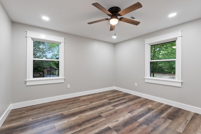 26 W Mobbs Cir, Greenbrier, AR 72058 - empty room featuring plenty of natural light, ceiling fan, recessed lighting, and dark wood-type flooring