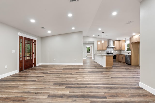 26 W Mobbs Cir, Greenbrier, AR 72058 - kitchen featuring appliances with stainless steel finishes, wall chimney exhaust hood, open floor plan, lofted ceiling, and healthy amount of natural light