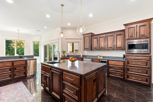 5090 Oakhurst Way, Conway, AR 72034 - kitchen with stainless steel appliances, wine cooler, a center island with sink, pendant lighting, and dark stone countertops