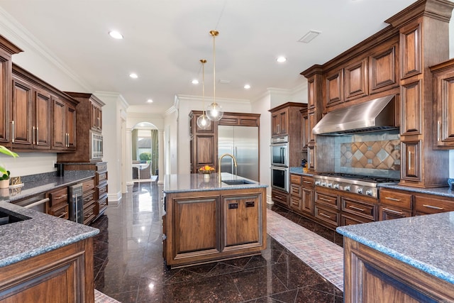 5090 Oakhurst Way, Conway, AR 72034 - kitchen featuring under cabinet range hood, arched walkways, built in appliances, granite tiled floors, and recessed lighting