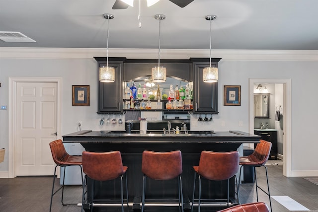 5090 Oakhurst Way, Conway, AR 72034 - indoor wet bar with ceiling fan, crown molding, dark wood-style flooring, and pendant lighting