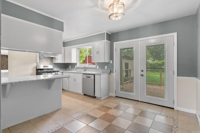 9317 Cynthia Dr, Little Rock, AR 72204 - kitchen featuring appliances with stainless steel finishes, french doors, and light tile patterned flooring