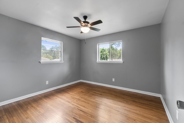 9317 Cynthia Dr, Little Rock, AR 72204 - spare room with healthy amount of natural light, a ceiling fan, and wood finished floors