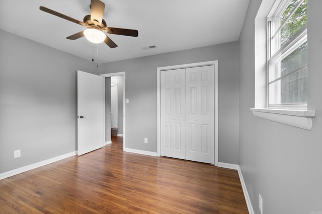 9317 Cynthia Dr, Little Rock, AR 72204 - unfurnished bedroom with wood finished floors, a closet, and ceiling fan