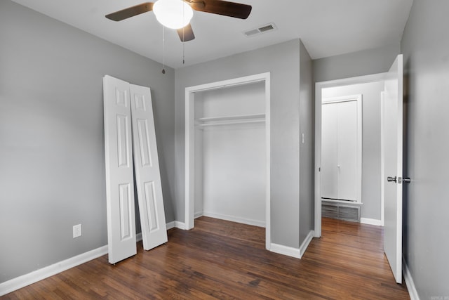 9317 Cynthia Dr, Little Rock, AR 72204 - unfurnished bedroom featuring dark wood-style floors, a closet, and a ceiling fan