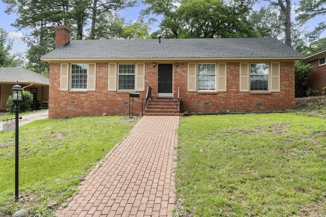 12 Holly Hill Rd, Little Rock, AR 72204 - view of front of home with a chimney, a front yard, brick siding, and entry steps