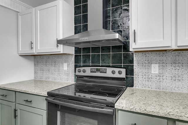 1550 E Main St, Austin, AR 72007 - kitchen featuring electric stove, wall chimney range hood, backsplash, and light stone countertops