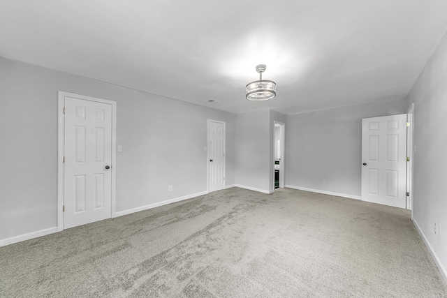 1550 E Main St, Austin, AR 72007 - spare room featuring a chandelier and carpet flooring