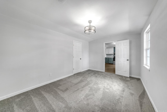 1550 E Main St, Austin, AR 72007 - unfurnished bedroom with carpet flooring and a chandelier