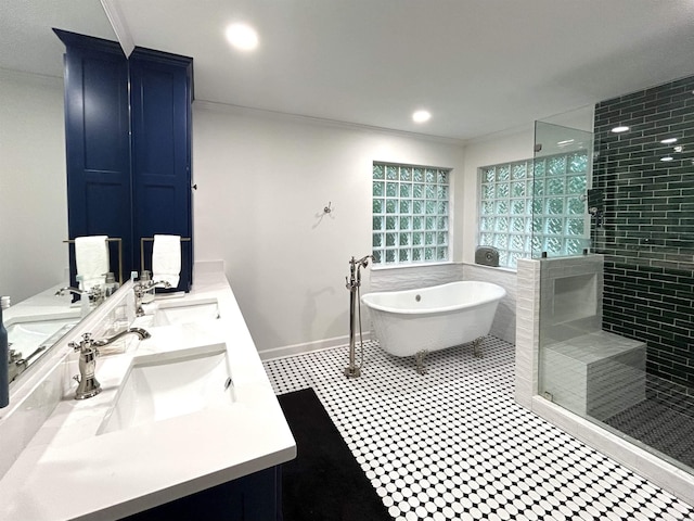 1715 Royal Dr, Conway, AR 72034 - full bathroom with double vanity, tiled shower, a freestanding bath, and crown molding