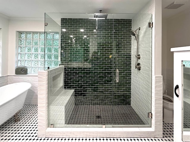 1715 Royal Dr, Conway, AR 72034 - bathroom featuring a stall shower, a soaking tub, ornamental molding, tile patterned flooring, and tile walls