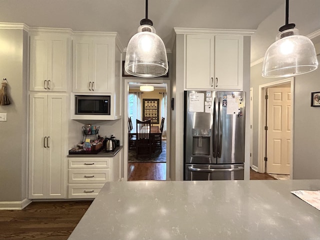 1715 Royal Dr, Conway, AR 72034 - kitchen with stainless steel appliances, dark wood finished floors, white cabinets, and decorative light fixtures