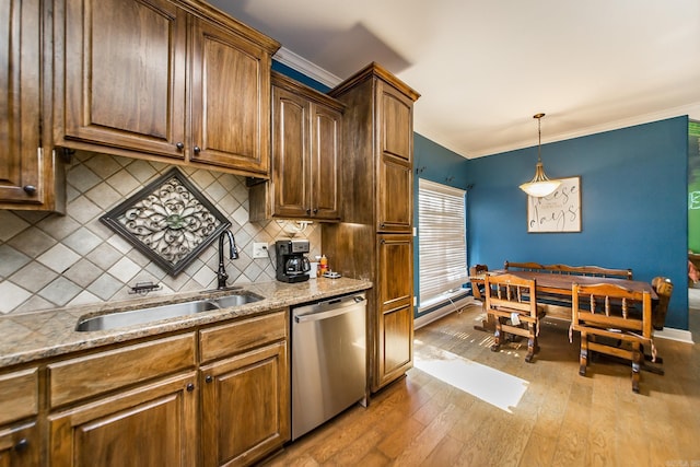 3200 Overcup Dr, Sherwood, AR 72120 - kitchen with stainless steel dishwasher, hardwood / wood-style floors, ornamental molding, tasteful backsplash, and light stone counters