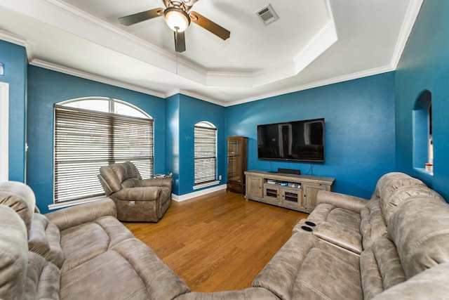 3200 Overcup Dr, Sherwood, AR 72120 - living room featuring ceiling fan, wood finished floors, a tray ceiling, and ornamental molding