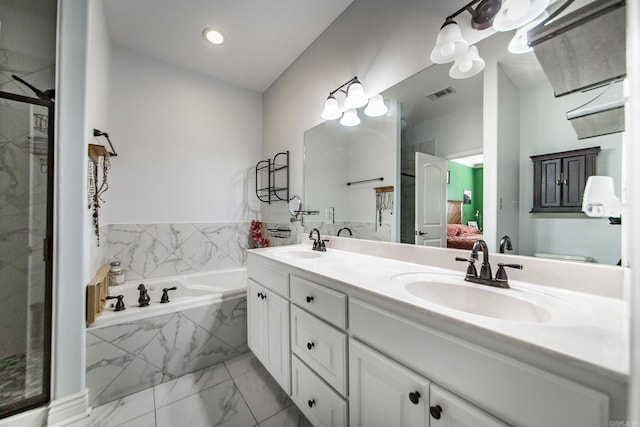 3200 Overcup Dr, Sherwood, AR 72120 - bathroom featuring a bath, marble finish flooring, double vanity, ensuite bath, and a shower stall