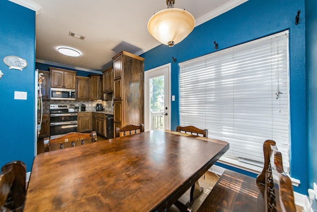 3200 Overcup Dr, Sherwood, AR 72120 - dining space featuring crown molding and baseboards