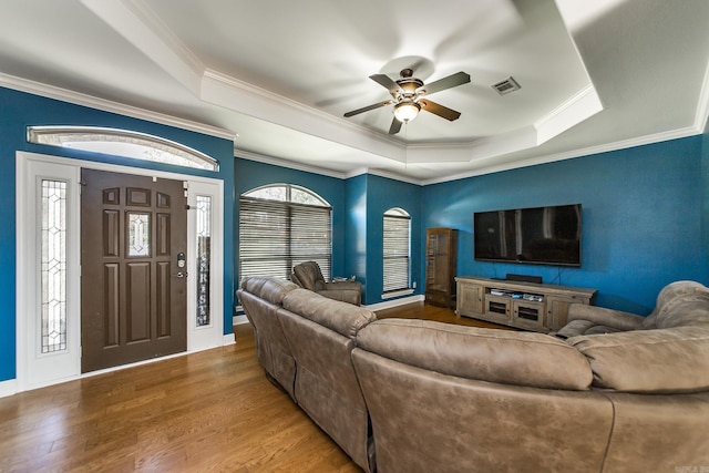 3200 Overcup Dr, Sherwood, AR 72120 - living area with a tray ceiling, ceiling fan, wood finished floors, and ornamental molding