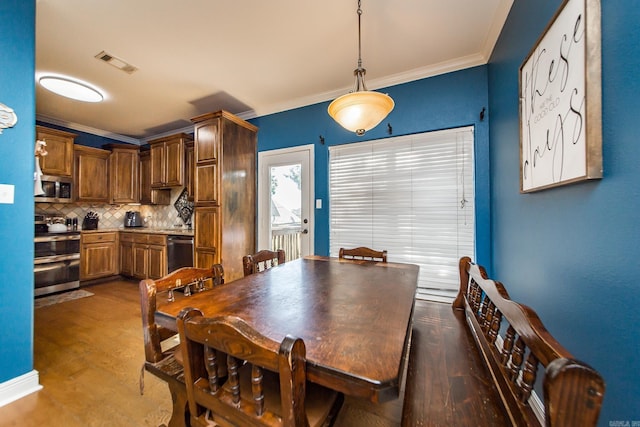 3200 Overcup Dr, Sherwood, AR 72120 - dining area with ornamental molding and wood finished floors